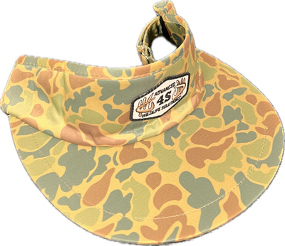 A camouflage tall visor with a white hexagon patch on the front and an adjustable buckle on the back.