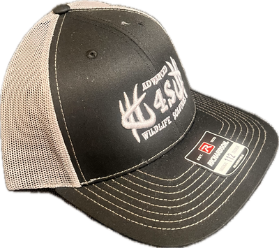A black and white mesh hat with an embroidered logo on the front, a black bill, and white stitching.