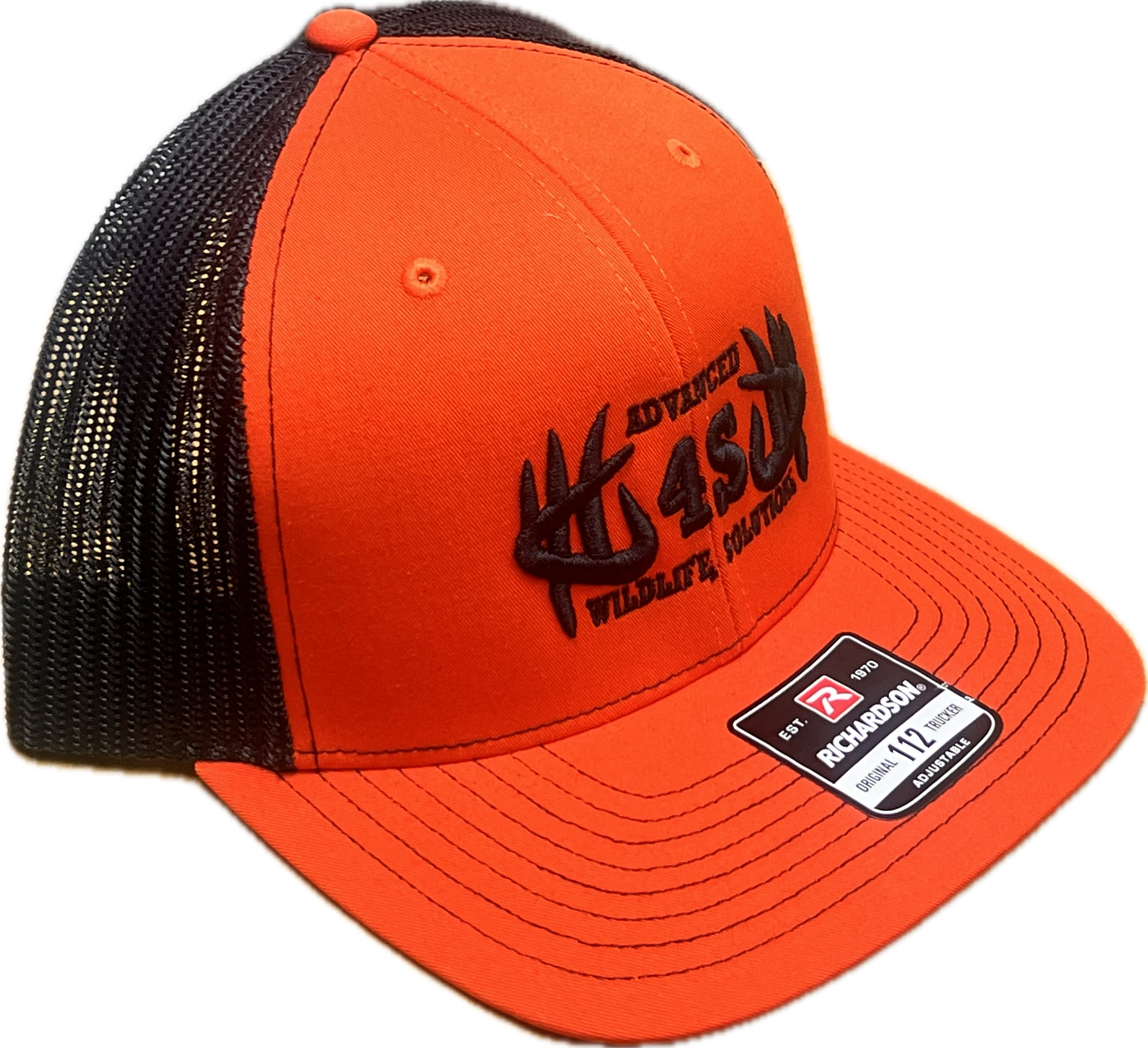 A dark orange hat with black mesh back and black embroidered logo.